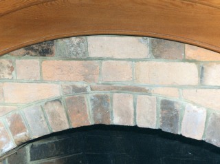 Detail of fireplace, west room